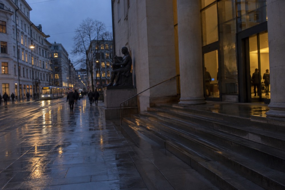 Rain-wet pavement outside a museum entrance in central Oslo