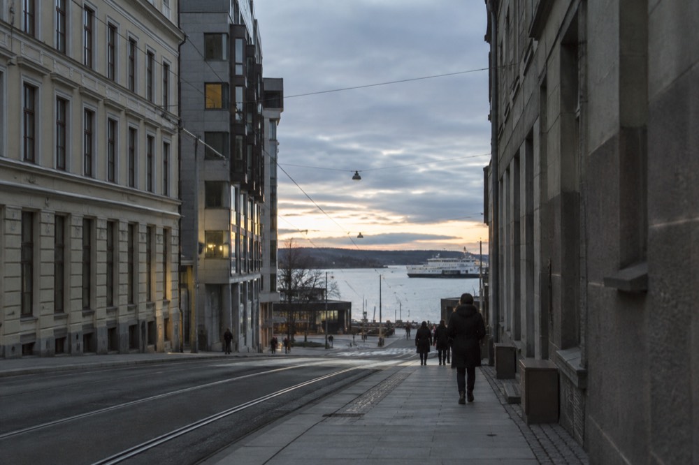 Evening light over the Oslofjord with a ferry terminal in the distance