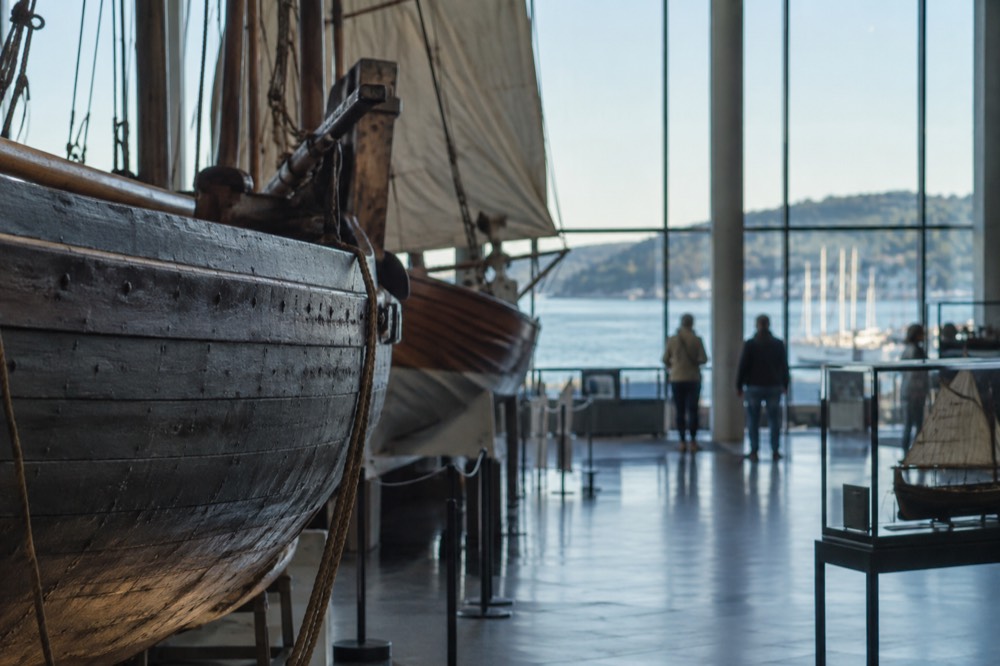 Museum ships and wooden hulls inside a maritime museum hall