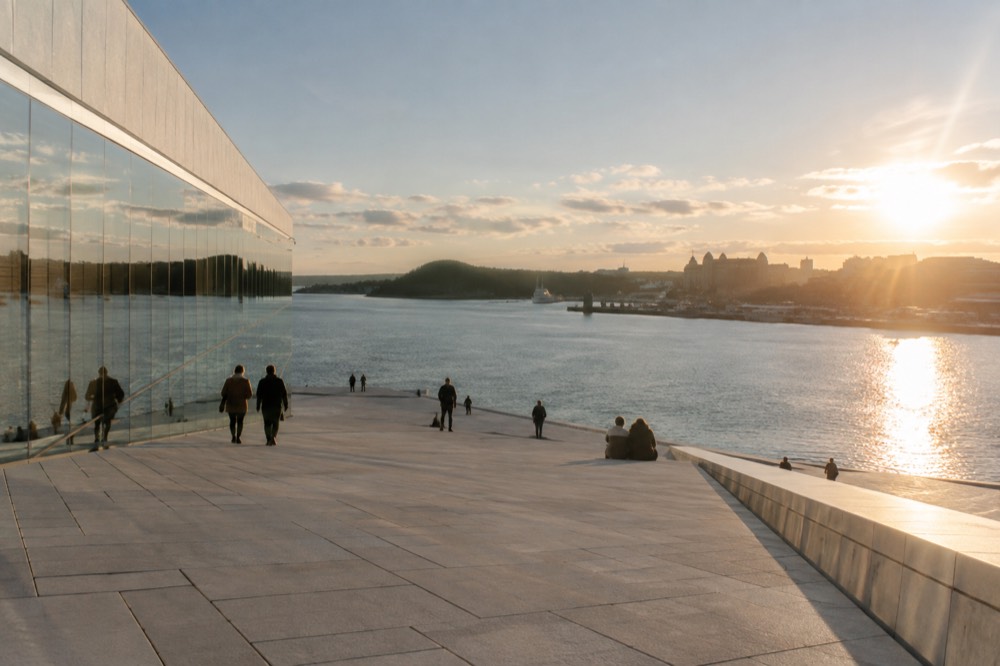 White marble roof of the Oslo Opera House sloping down to the fjord