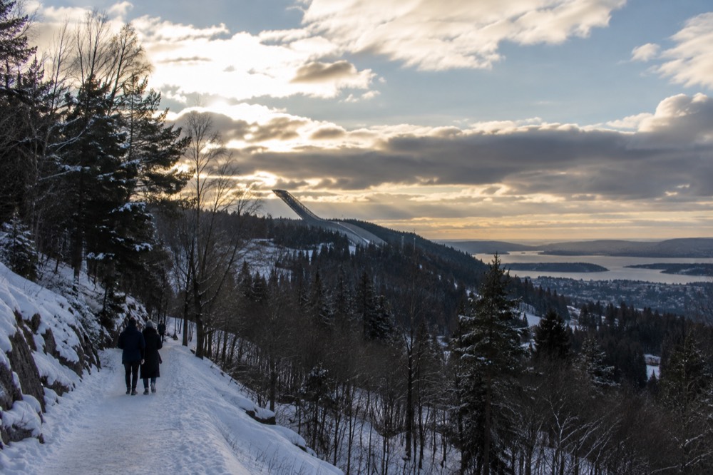 Ski jump tower above forested hills at Holmenkollen