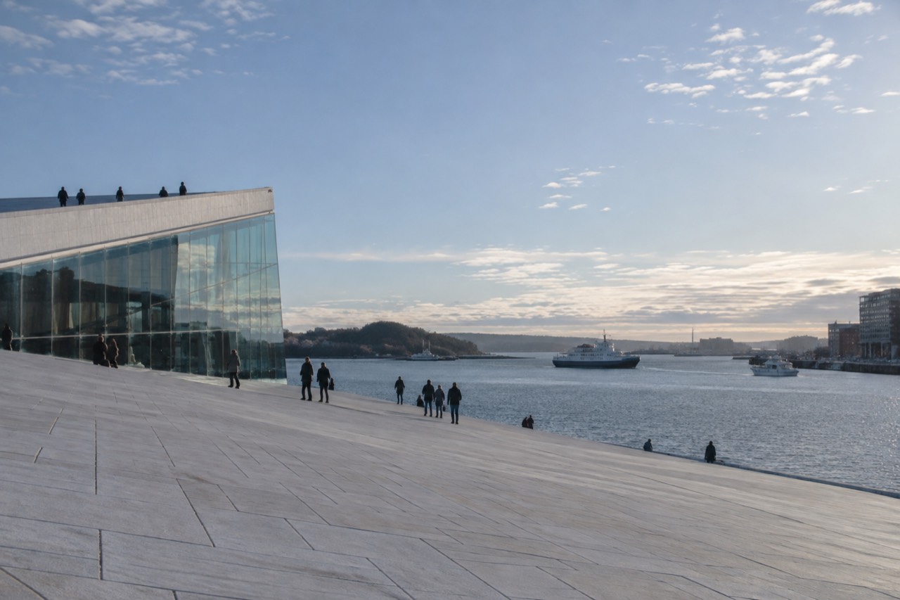 Oslo Opera House waterfront with fjord boats in the background