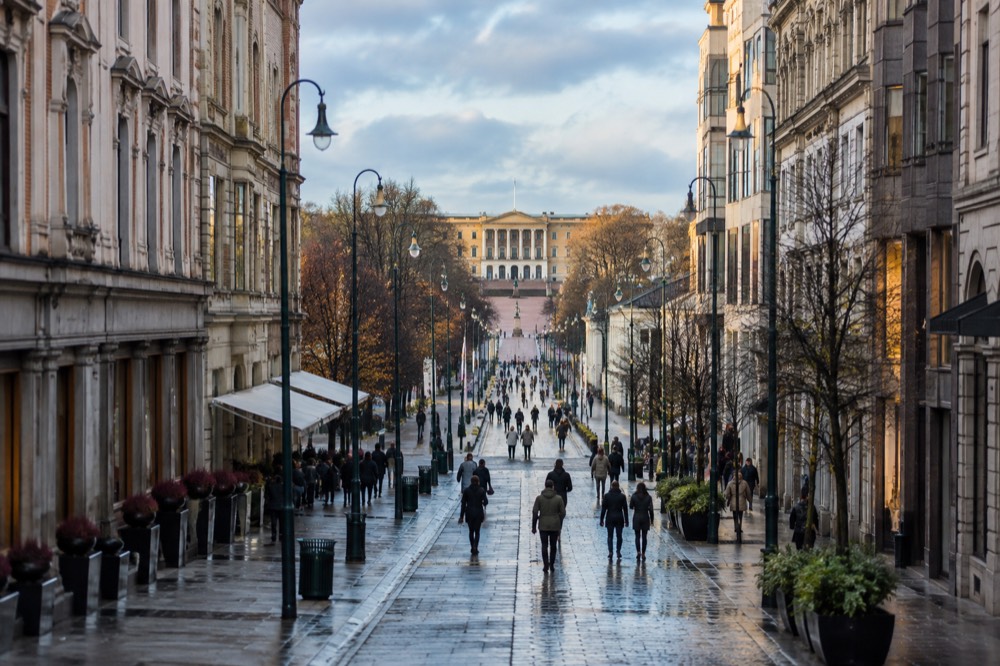 Karl Johans gate pedestrian street with the Royal Palace visible in the distance