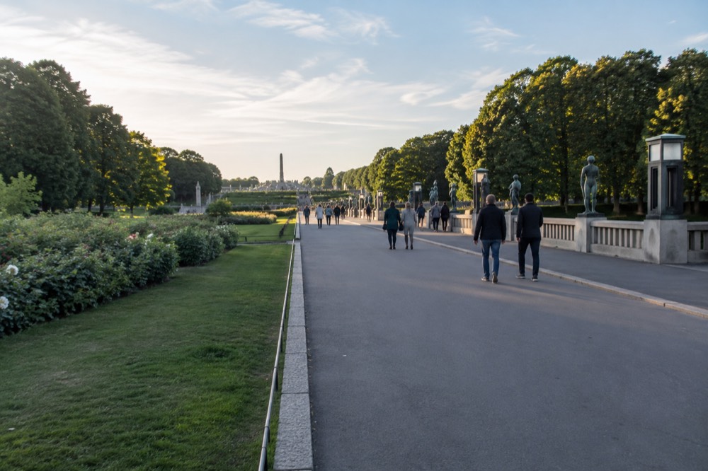 Sculptures along the formal axis of Vigeland Park with trees either side