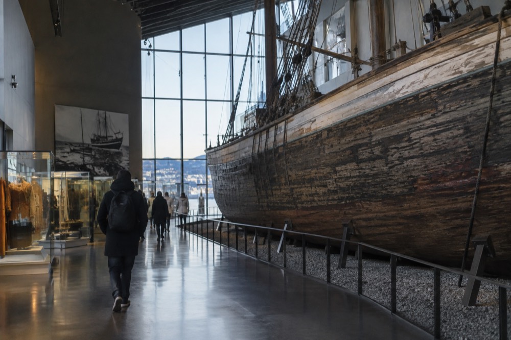 Wooden polar expedition ship displayed inside a museum hall