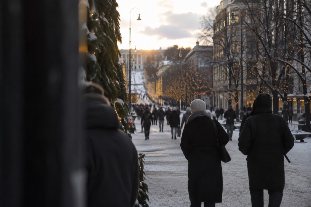 Karl Johans gate in Oslo lined with Christmas lights in the early winter dark