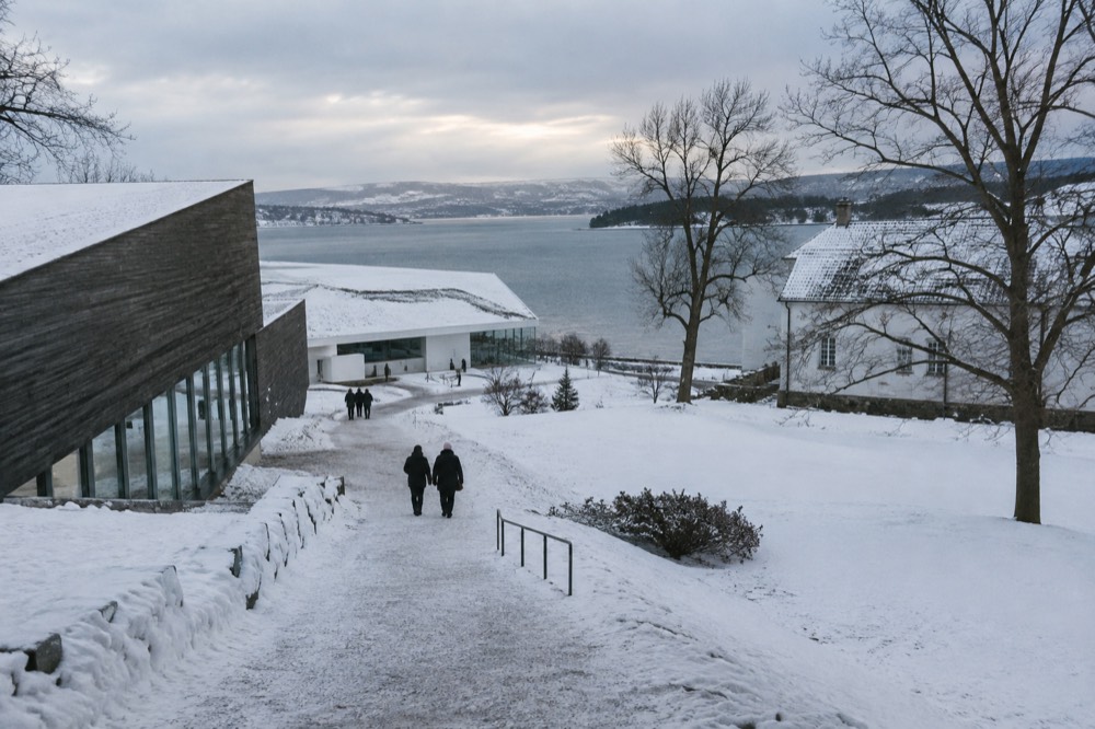 Museum buildings on Bygdøy peninsula under low winter light and snow